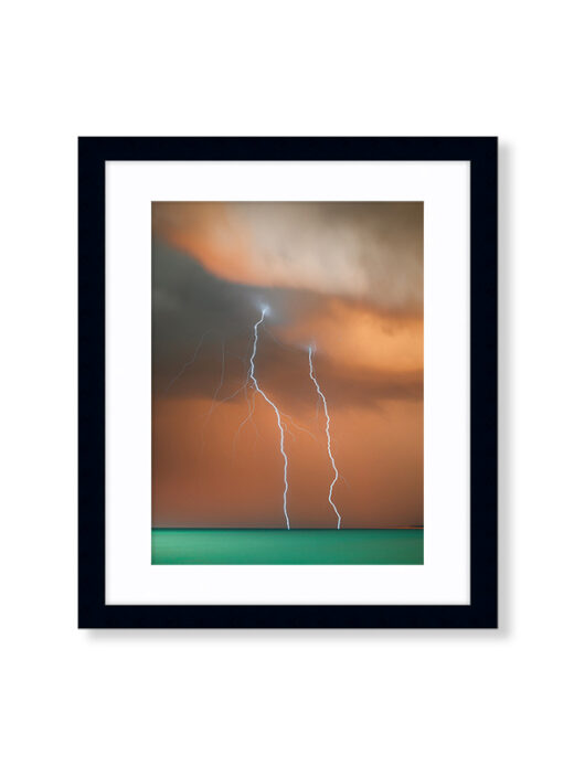 A Sunset Storm Photo of Lightning off Cable Beach in Broome Western Australia. Available as a fine art framed photo print.