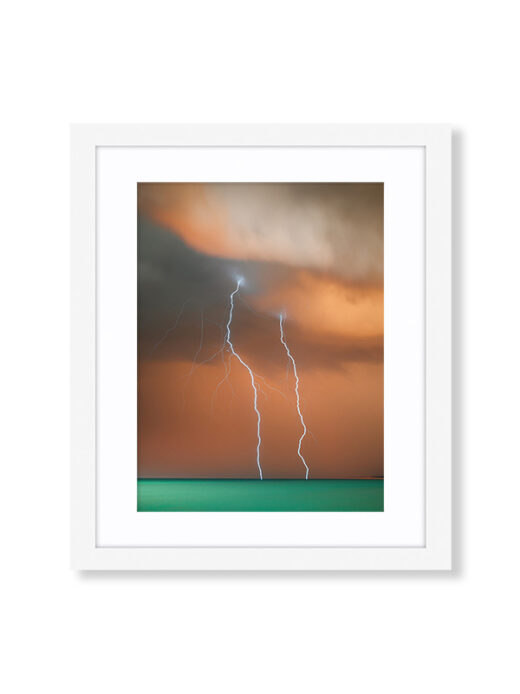 A Sunset Storm Photo of Lightning off Cable Beach in Broome Western Australia. Available as a fine art framed photo print.