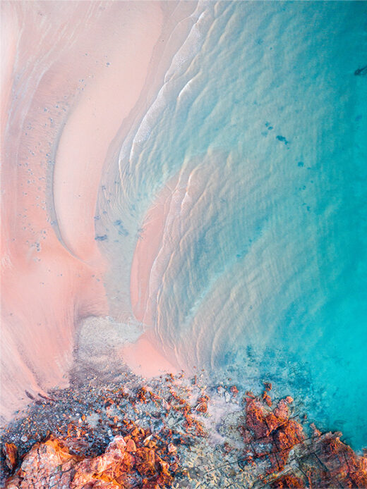 Entrance Point Pink Beach at sunrise from a drone in Broome Western Australia available as a fine art framed or canvas print