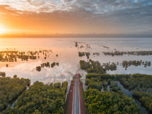 Roebuck Plains in Broome flooded at sunrise after heavy flooding from rain in fitzroy crossing fitzroy river.